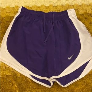 Purple and white NIKE running shorts